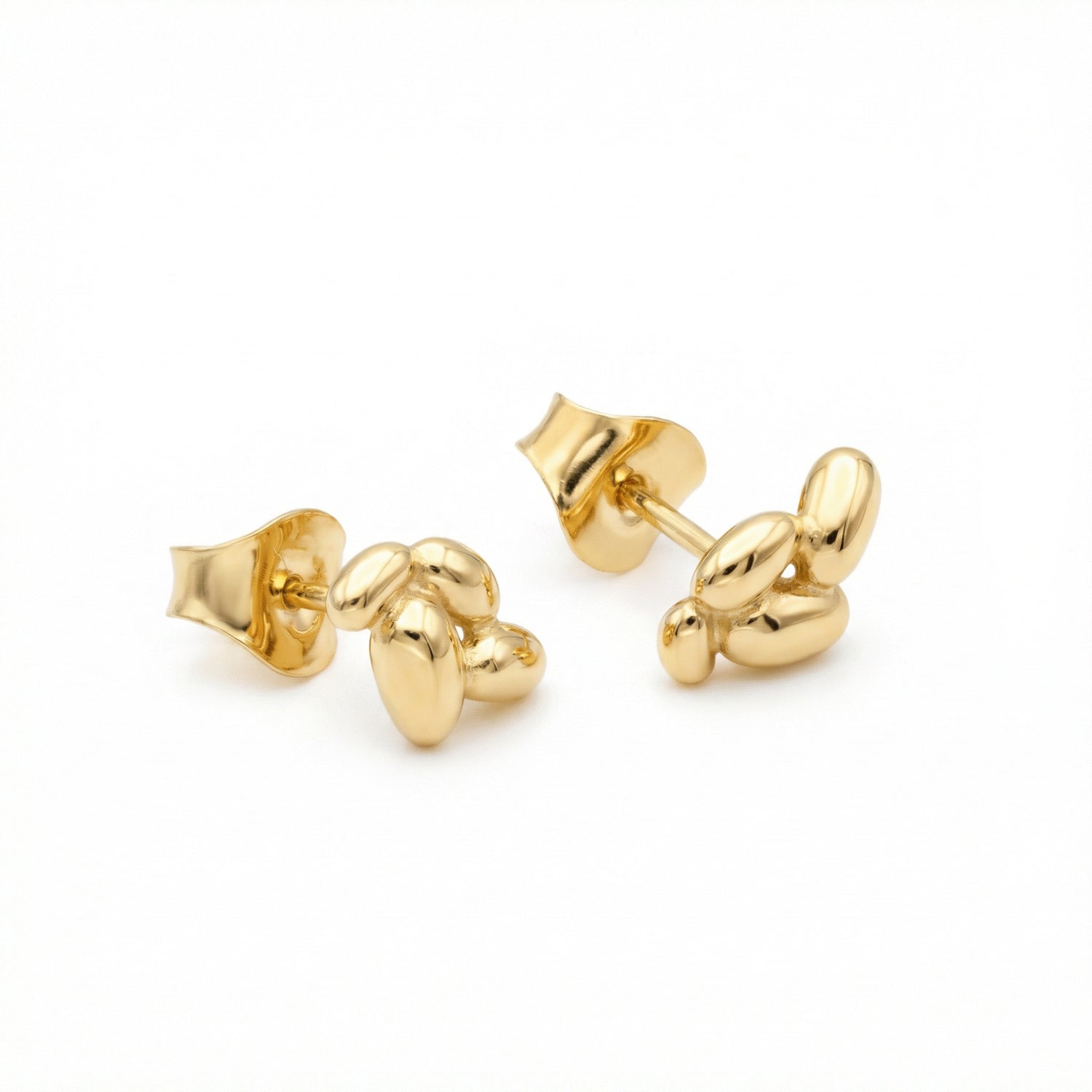 Gold EVA potato inspired 18K stud earrings arranged along bottom on white background