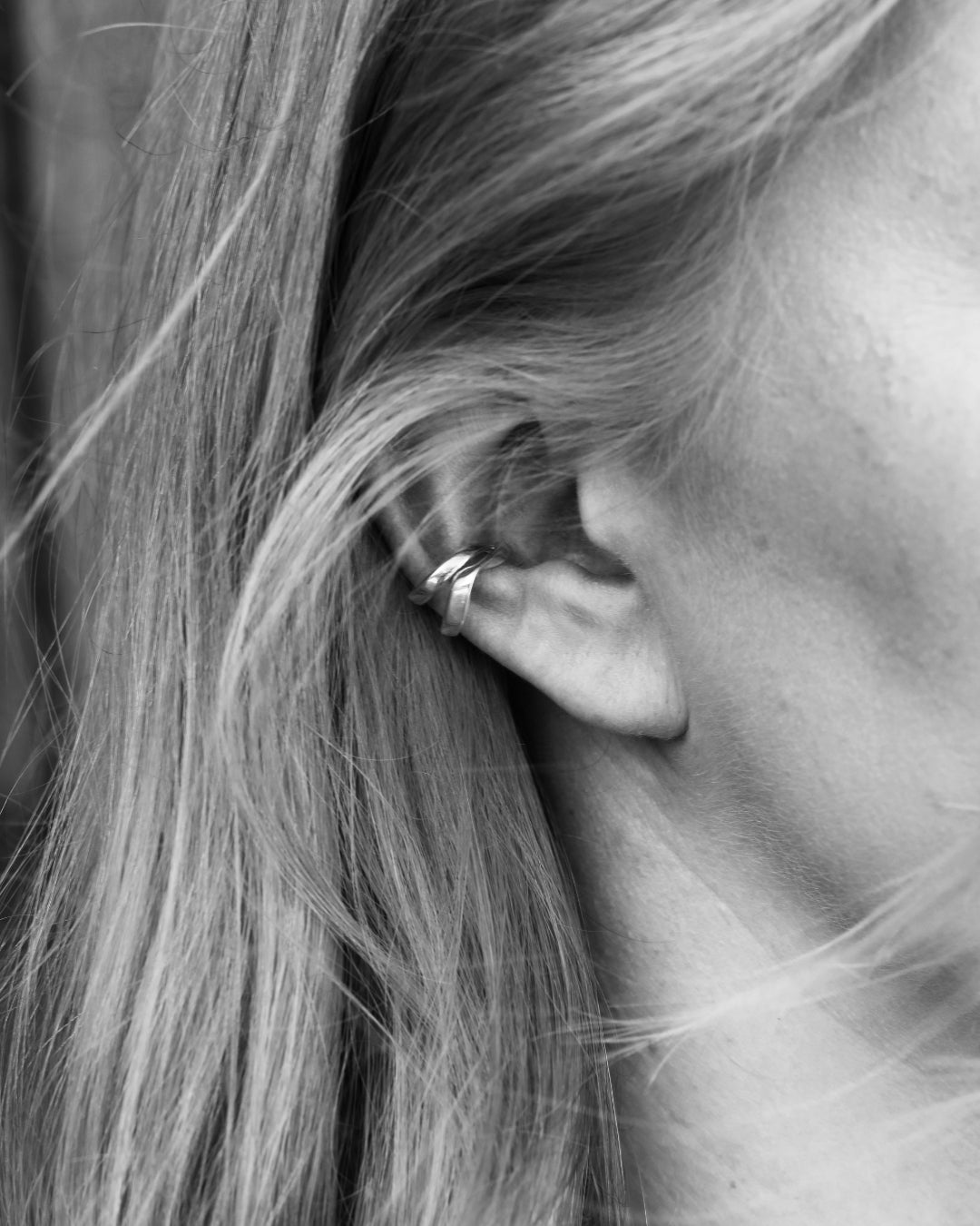 Close-up of ear wearing a STORMSKÄRS MAJA ear cuff in sterling silver