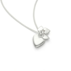 Sterling silver heart pendant with a flower motif on a silver chain