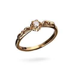 Lily of Love ring in 18K gold with a central diamond and floral detailing.