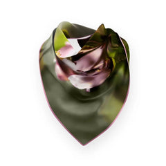 Silk scarf featuring apple blossom motif in pinks and greens with a pink border, laid flat on a white background.