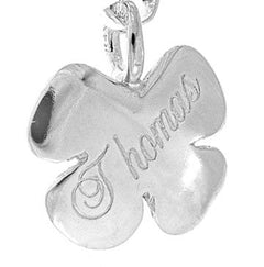 Silver four leaf clover charm engraved with the word Thanks.