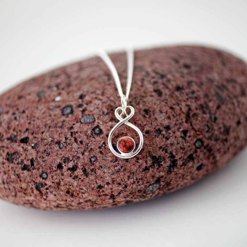 Red granite in sterling silver, ÅLANDSHJÄRTA (Heart of Åland), handcrafted by GULDVIVA.